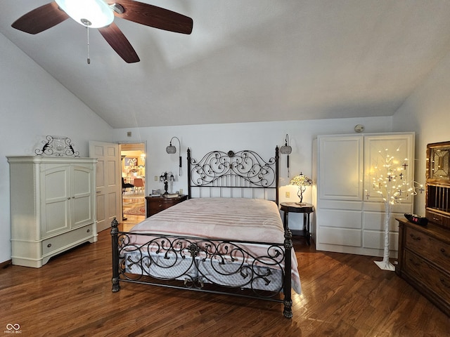 bedroom with dark wood finished floors, ceiling fan, and lofted ceiling