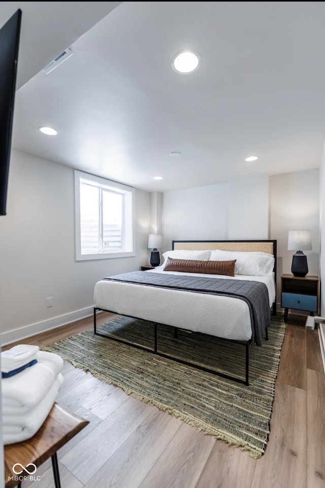 1802 Bellefontaine St, Indianapolis, IN 46202 - bedroom with baseboards, wood finished floors, and recessed lighting