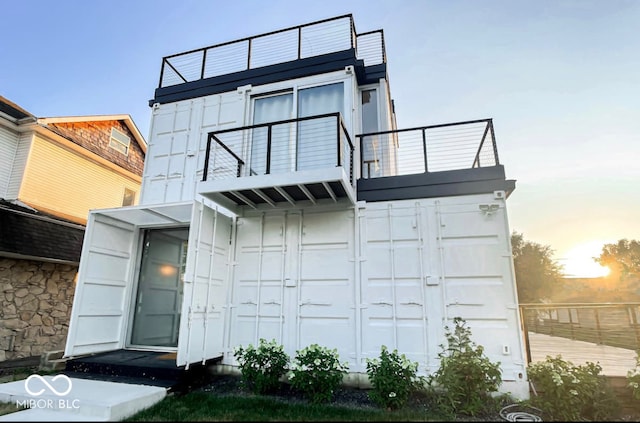 1802 Bellefontaine St, Indianapolis, IN 46202 - view of front of house with a balcony and board and batten siding