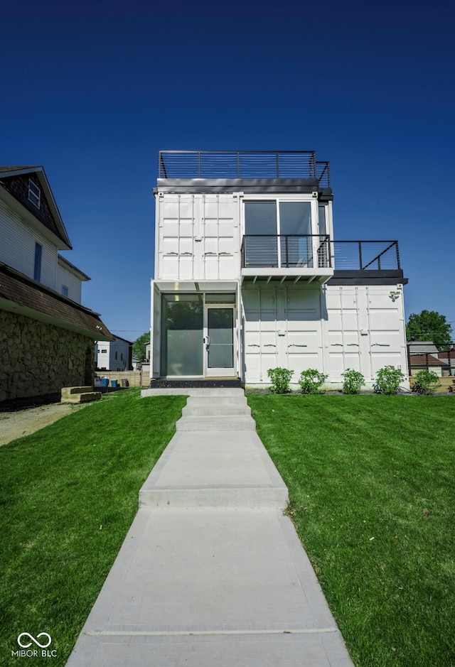 1802 Bellefontaine St, Indianapolis, IN 46202 - view of front of home featuring a balcony and a front lawn