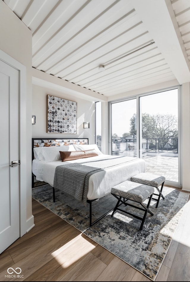 1802 Bellefontaine St, Indianapolis, IN 46202 - bedroom featuring wood finished floors and access to outside