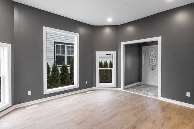 555 N Hamilton Ave, Indianapolis, IN 46201 - foyer featuring baseboards, visible vents, and light wood-type flooring