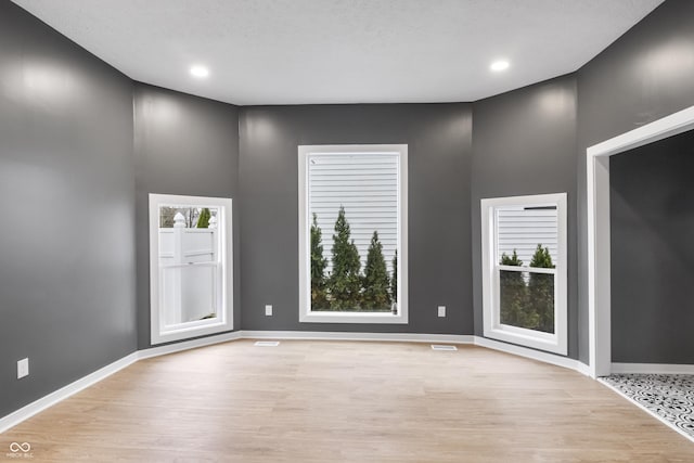 555 N Hamilton Ave, Indianapolis, IN 46201 - empty room featuring light wood finished floors, baseboards, visible vents, and recessed lighting