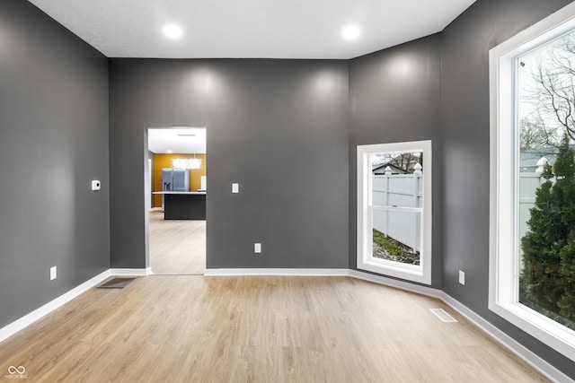 555 N Hamilton Ave, Indianapolis, IN 46201 - unfurnished room with recessed lighting, visible vents, baseboards, and wood finished floors
