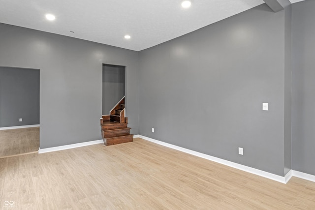 555 N Hamilton Ave, Indianapolis, IN 46201 - unfurnished room featuring baseboards, light wood-style floors, stairway, and recessed lighting