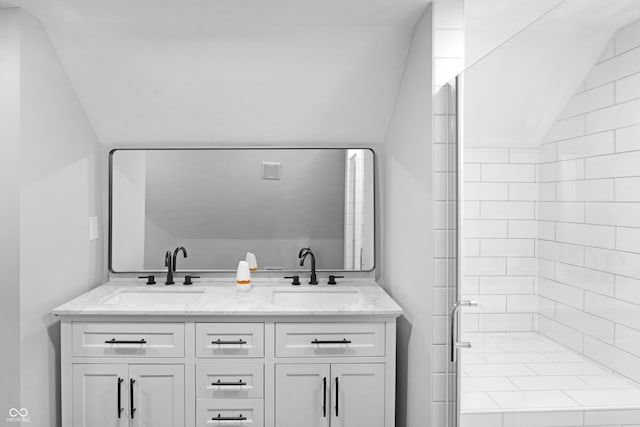555 N Hamilton Ave, Indianapolis, IN 46201 - bathroom with a shower stall, double vanity, lofted ceiling, and a sink