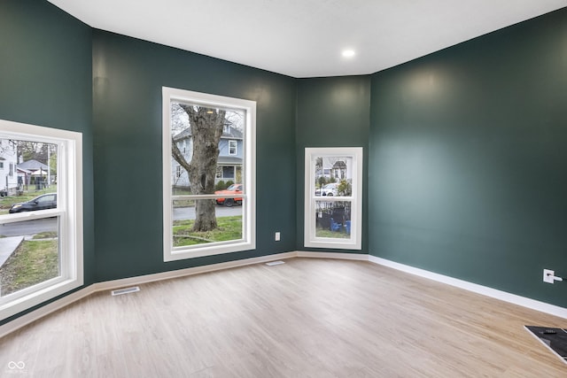 555 N Hamilton Ave, Indianapolis, IN 46201 - empty room with visible vents, baseboards, and wood finished floors