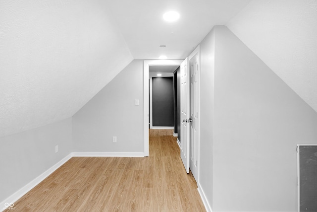 555 N Hamilton Ave, Indianapolis, IN 46201 - bonus room with baseboards, lofted ceiling, and light wood finished floors