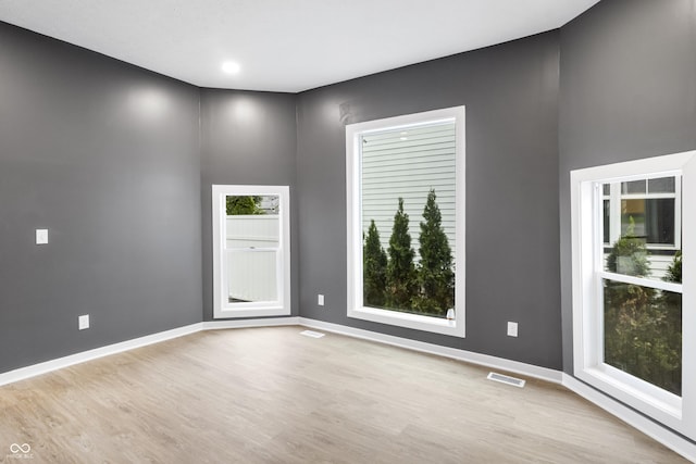 555 N Hamilton Ave, Indianapolis, IN 46201 - spare room with baseboards, visible vents, and wood finished floors