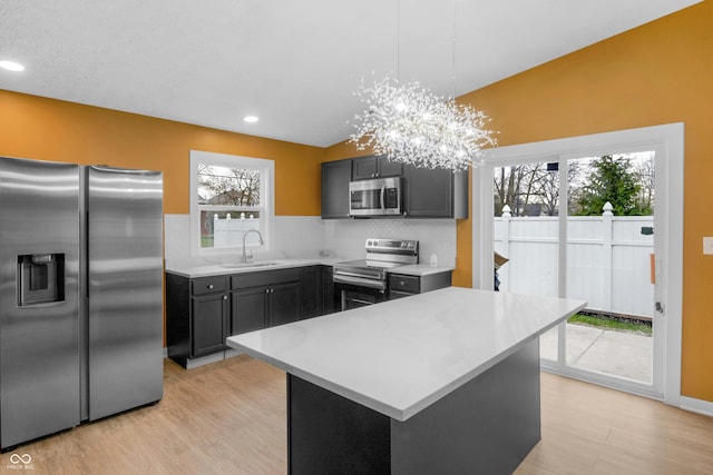 555 N Hamilton Ave, Indianapolis, IN 46201 - kitchen featuring light countertops, a sink, stainless steel appliances, and light wood-style floors