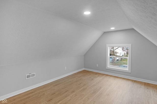 555 N Hamilton Ave, Indianapolis, IN 46201 - bonus room featuring light wood-type flooring, a textured ceiling, baseboards, and visible vents