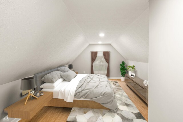 555 N Hamilton Ave, Indianapolis, IN 46201 - bedroom with a textured ceiling, baseboards, vaulted ceiling, and wood finished floors