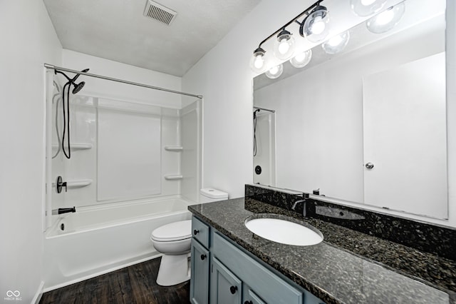 6036 Terrytown Pkwy, Indianapolis, IN 46254 - full bath with visible vents, toilet, wood finished floors, vanity, and shower / bathtub combination