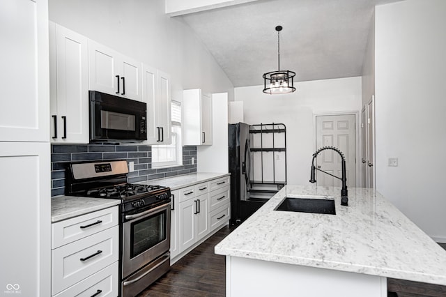 6036 Terrytown Pkwy, Indianapolis, IN 46254 - kitchen with an island with sink, a sink, black appliances, decorative backsplash, and dark wood-style flooring