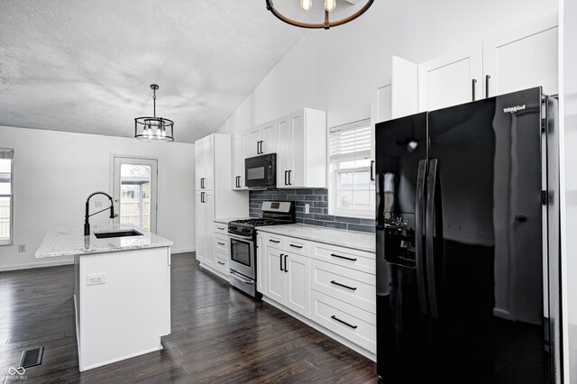 6036 Terrytown Pkwy, Indianapolis, IN 46254 - kitchen featuring vaulted ceiling, black appliances, a sink, and an inviting chandelier