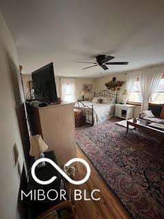 bedroom featuring wood finished floors
