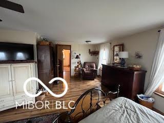 bedroom with wood finished floors