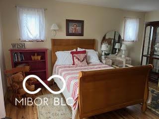 bedroom with wood finished floors