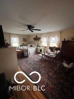 bedroom with multiple windows