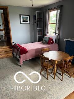 bedroom featuring wood finished floors