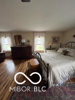 bedroom featuring wood finished floors