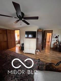 living room featuring ceiling fan and wood finished floors