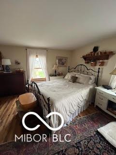bedroom featuring wood finished floors