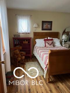 bedroom featuring wood finished floors