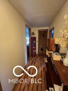 hallway with wood finished floors