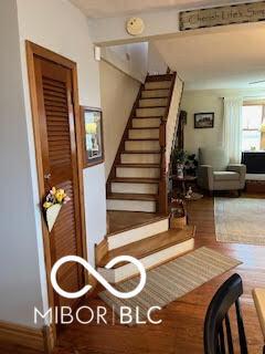 stairway featuring wood finished floors