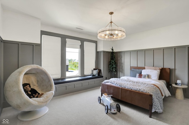 5130 Melbourne Pl, Zionsville, IN 46077 - bedroom with a decorative wall, carpet floors, a chandelier, and wainscoting