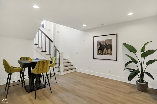 5130 Melbourne Pl, Zionsville, IN 46077 - dining area featuring light wood-style flooring, stairway, recessed lighting, and baseboards