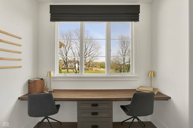 5130 Melbourne Pl, Zionsville, IN 46077 - office with built in desk, baseboards, and plenty of natural light