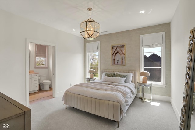 5130 Melbourne Pl, Zionsville, IN 46077 - bedroom with light carpet, a chandelier, multiple windows, and baseboards