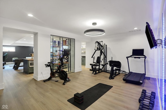 5130 Melbourne Pl, Zionsville, IN 46077 - exercise area with wood finished floors, baseboards, and recessed lighting