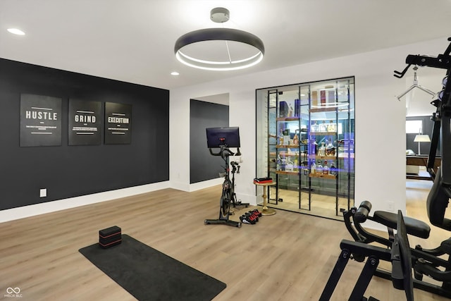 5130 Melbourne Pl, Zionsville, IN 46077 - workout area with wood finished floors, recessed lighting, and baseboards