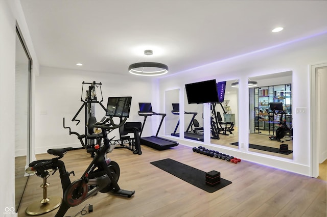 5130 Melbourne Pl, Zionsville, IN 46077 - workout room with wood finished floors and recessed lighting