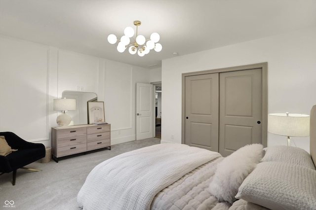 5130 Melbourne Pl, Zionsville, IN 46077 - bedroom with light carpet, a chandelier, and a closet