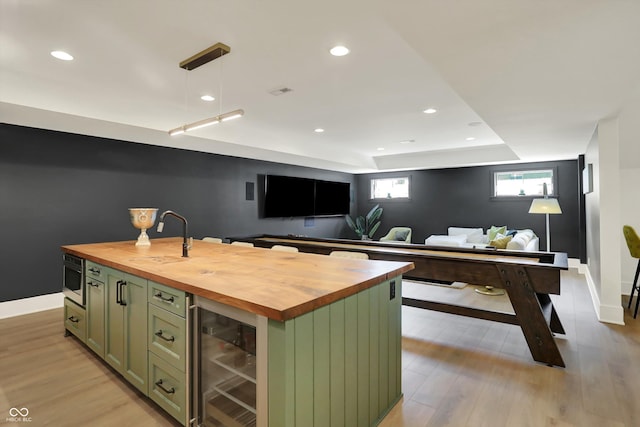 5130 Melbourne Pl, Zionsville, IN 46077 - indoor bar with beverage cooler, light wood finished floors, baseboards, decorative light fixtures, and recessed lighting