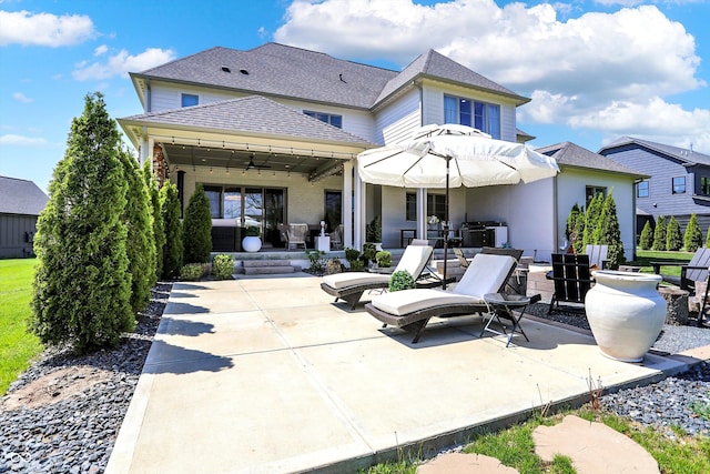 5130 Melbourne Pl, Zionsville, IN 46077 - rear view of property featuring a patio, a ceiling fan, and a shingled roof