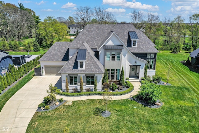 5130 Melbourne Pl, Zionsville, IN 46077 - french country style house with stucco siding, driveway, a front yard, and a garage