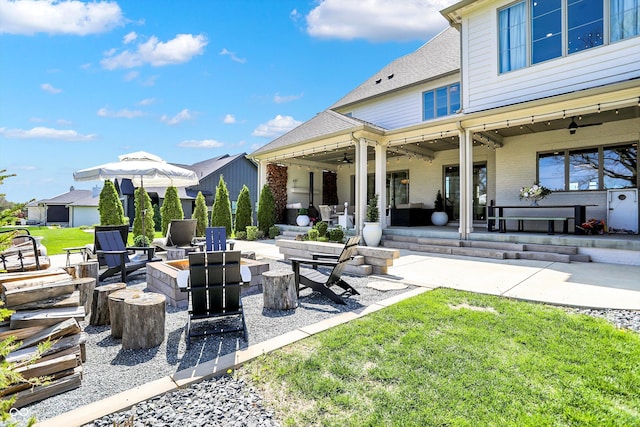 5130 Melbourne Pl, Zionsville, IN 46077 - view of patio featuring a ceiling fan and an outdoor living space with a fire pit