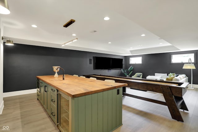 5130 Melbourne Pl, Zionsville, IN 46077 - office area featuring beverage cooler, light wood-type flooring, baseboards, and recessed lighting