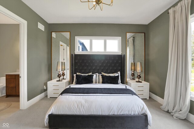 5130 Melbourne Pl, Zionsville, IN 46077 - bedroom featuring light colored carpet, a chandelier, and baseboards