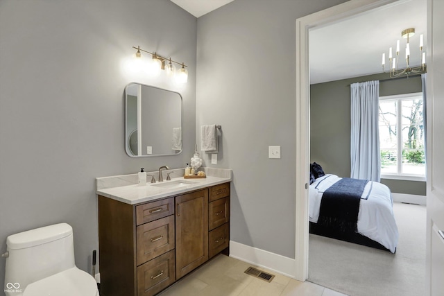 5130 Melbourne Pl, Zionsville, IN 46077 - bathroom with vanity, a chandelier, baseboards, connected bathroom, and tile patterned floors