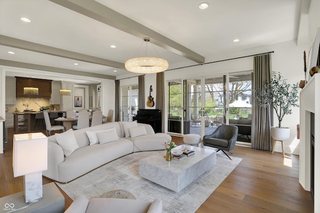 5130 Melbourne Pl, Zionsville, IN 46077 - living area with beamed ceiling, wood finished floors, and recessed lighting
