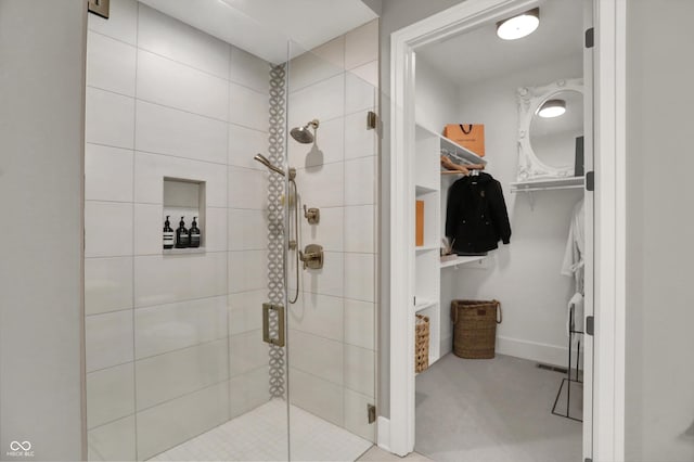 5130 Melbourne Pl, Zionsville, IN 46077 - full bathroom with a shower stall, a walk in closet, and baseboards