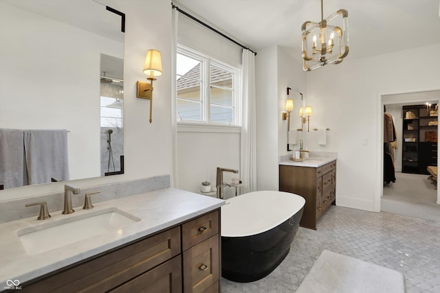 5130 Melbourne Pl, Zionsville, IN 46077 - full bath featuring two vanities, a freestanding tub, a chandelier, a shower, and baseboards