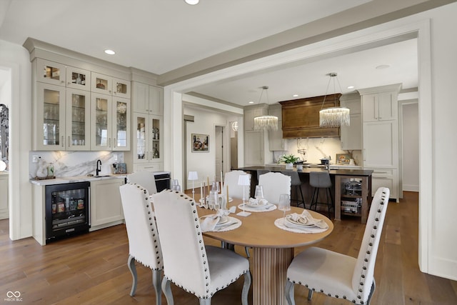 5130 Melbourne Pl, Zionsville, IN 46077 - dining room with wine cooler, dark wood-type flooring, recessed lighting, wet bar, and baseboards