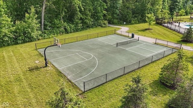 5130 Melbourne Pl, Zionsville, IN 46077 - view of basketball court featuring a tennis court, community basketball court, and a view of trees